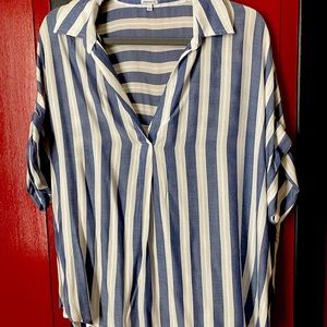 Stylish blouse that dresses up any look with detailed buttoned back